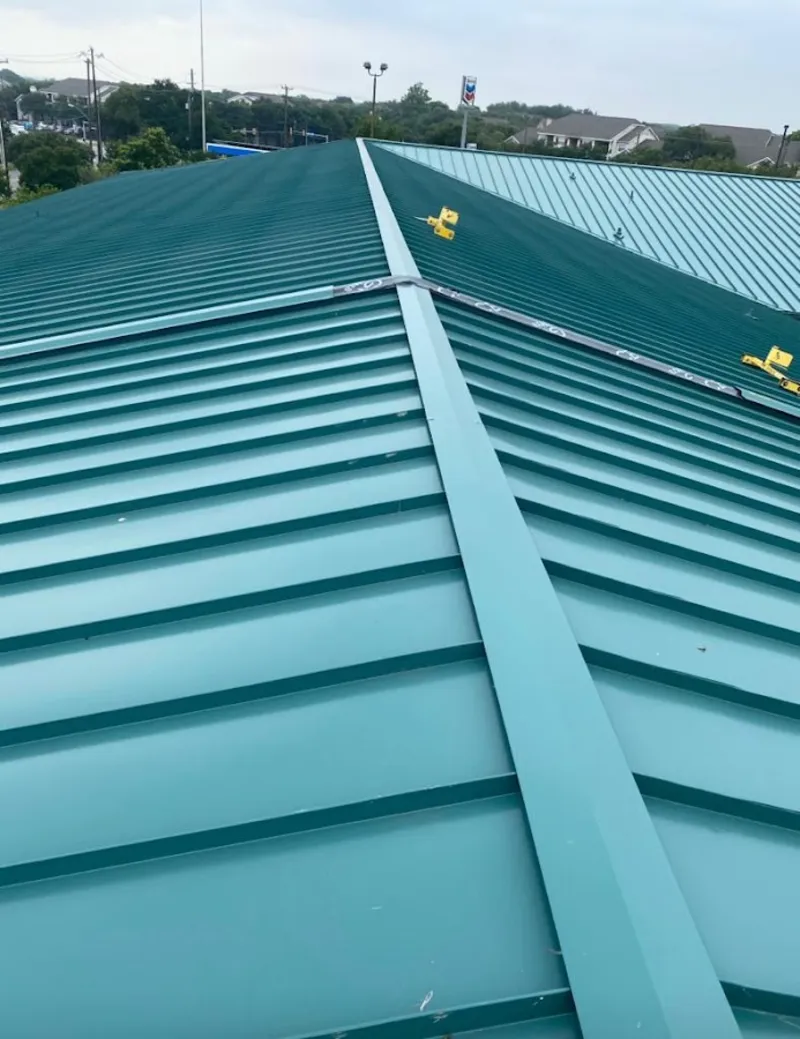 Green commercial metal roof ridge and valley for Metal Roof Repair in Farmington